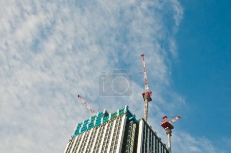 Photo for Underconstruction building in progress with many construction cranes - Royalty Free Image