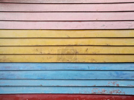 Photo for Pink yellow blue red planks, wooden board background wall - Royalty Free Image