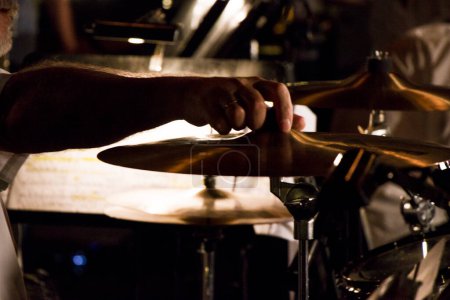 Photo for Closeup of male hands playing a drum - Royalty Free Image