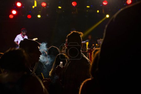 Photo for Live music concert, night life and crowd people, standing and listening music young adult people. - Royalty Free Image