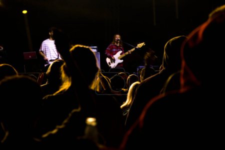 Photo for Live music concert, night life and crowd people, standing and listening music young adult people. - Royalty Free Image