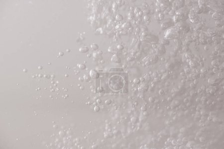Photo for The bubbles in the water are formed by moving the colored water. - Royalty Free Image