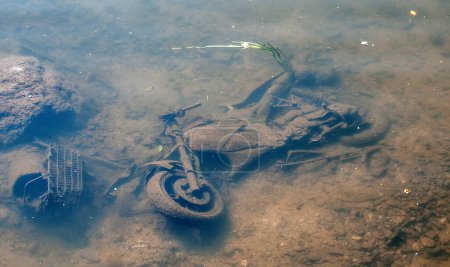 Photo for Abandoned motor bike in the river avon in bath england - Royalty Free Image