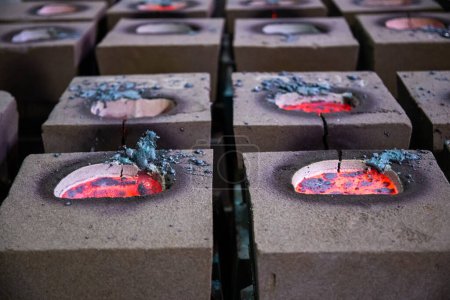 Photo for Cooling process of filled sand molds after steel casting, cracked during the process - Royalty Free Image