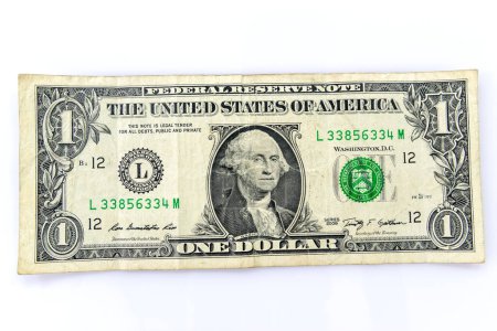 Téléchargez les photos : Un dollar sur fond blanc - en image libre de droit