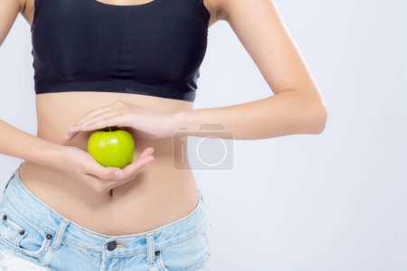 Photo for Beautiful body woman sexy slim holding green apple - Royalty Free Image
