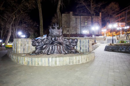 Photo for "Statue of Neptune in the Admiral Square in Vladivostok. Night illumination of Vladivostok streets." - Royalty Free Image