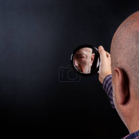 Photo for Ego concept man looking inside mirror - Royalty Free Image
