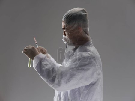 Photo for Male laboratory assistant protective clothing research science development - Royalty Free Image