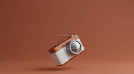 Téléchargez les photos : Caméra marron et blanc sur fond marron concept de photographie - en image libre de droit