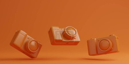 Foto de Cámaras digitales naranja sobre fondo naranja, concepto de tecnología. - Imagen libre de derechos
