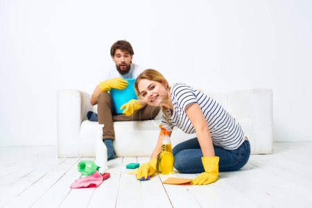 Photo for "Man and woman washing supplies cleaning housework" - Royalty Free Image