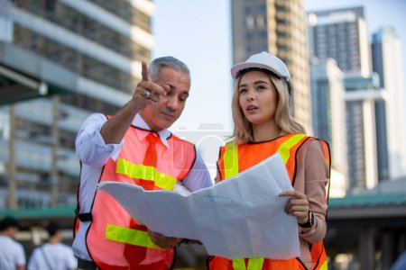 Photo for Engineering civil, Construction engineers discussion with architects at construction site or building site of high-rise building with Surveying for making contour plans - Royalty Free Image