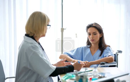 Photo for Doctor check up and discuss with patient in clinic or doctor talk with women patient in hospital - Royalty Free Image
