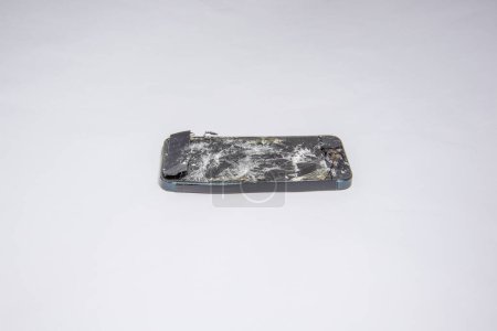 Photo for Broken and smashed iPhone isolated - Royalty Free Image
