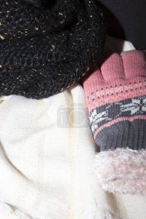 Photo for Warm knitted scarf and glove on  background. winter clothing. - Royalty Free Image