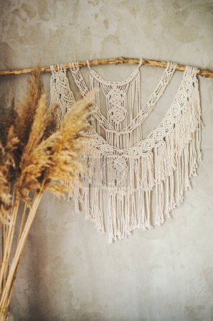 Photo for Beautiful boho macrame wall panel will add a cozy atmosphere - Royalty Free Image