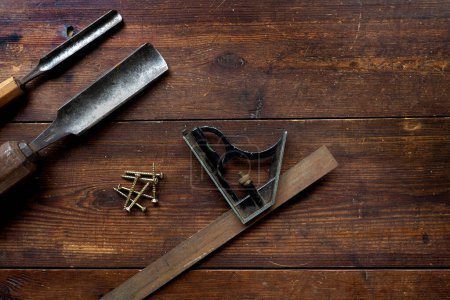 Photo for "Set square and chisels, flat lay, overhead as background" - Royalty Free Image