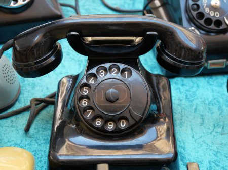 Photo for "Vintage rotary dial telephones on display in flea market Turin Italy June 8 2019" - Royalty Free Image