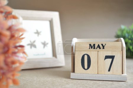 Photo for Wooden calendar with month of May and picture frame - Royalty Free Image