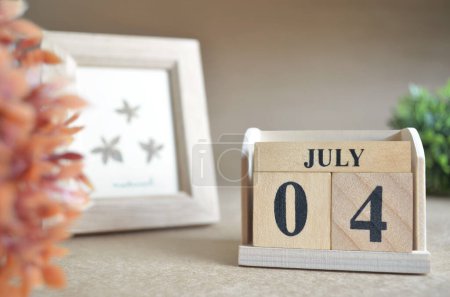 Photo for Wooden calendar with month of July, planning concept - Royalty Free Image