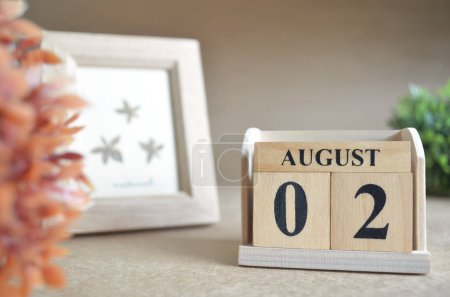 Photo for Wooden calendar with month of August, planning concept - Royalty Free Image