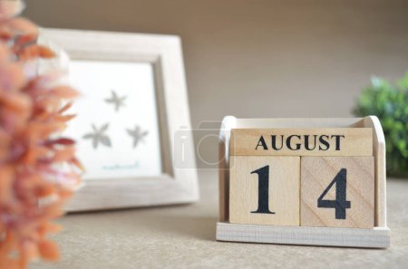 Photo for "close-up shot of wooden blocks calendar with August 14." - Royalty Free Image