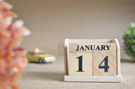 Photo for "close-up shot of wooden blocks calendar with January 14." - Royalty Free Image