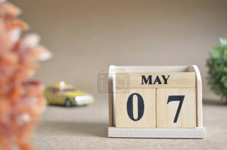 Photo for Wooden calendar with month of May with car toys - Royalty Free Image