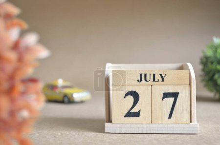 Photo for "close-up shot of wooden blocks calendar with July 27." - Royalty Free Image