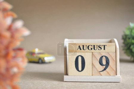 Photo for "close-up shot of wooden blocks calendar with August 9." - Royalty Free Image