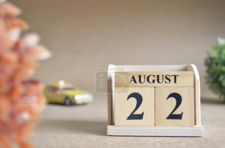 Photo for "close-up shot of wooden blocks calendar with August 22." - Royalty Free Image