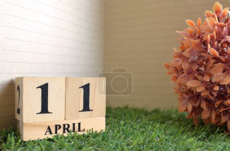 Photo for Wooden calendar with April month, planning concept - Royalty Free Image