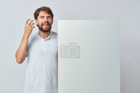 Photo for Man in white t-shirt white banner advertising isolated background - Royalty Free Image