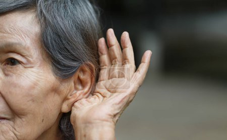 Photo for Elderly woman hearing loss , Hard of hearing - Royalty Free Image