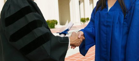 Photo for Cropped photo of Graduate Receiving Diploma - Royalty Free Image