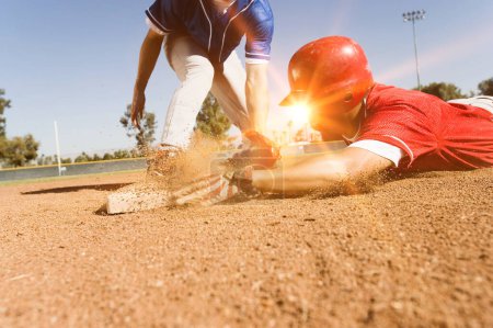 Photo for "Photo of Runner and Infielder Both Reaching Base". Baseball Game Concept - Royalty Free Image