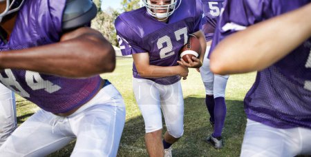 Photo for Multiethnic players playing American football on field - Royalty Free Image