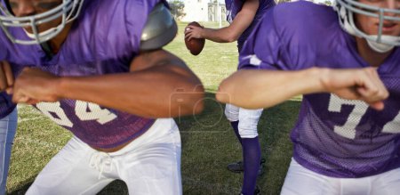 Photo for Multiethnic players playing American football on field - Royalty Free Image