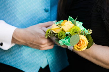 Photo for Teenage Girl wearing corsage with prom date - Royalty Free Image