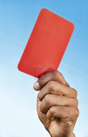 Photo for Soccer Referee Holding Out a Red Card - Royalty Free Image