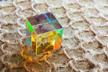 Foto de Colorful bright glass prism cube  Refracting light in vivid rainbow colors. - Imagen libre de derechos