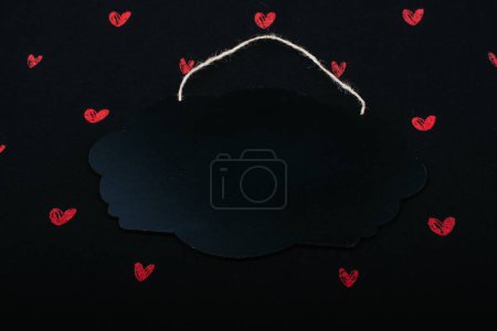 Photo for Black speech bubble shaped notice board  and red hearts - Royalty Free Image