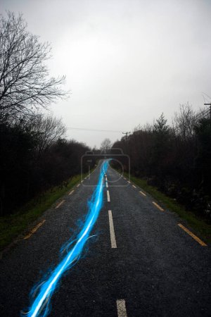 Photo for Blue energy on asphalt road - Royalty Free Image