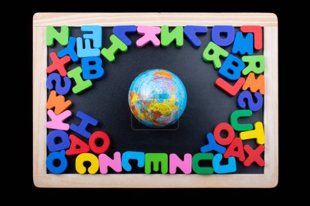 Photo for "Globe and colorful letters made of wood " - Royalty Free Image