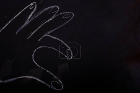 Photo for Chalk drawn hand making a half heart - Royalty Free Image
