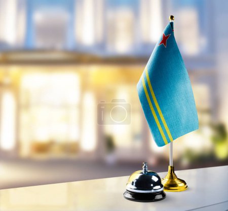 Photo for "Aruba flag on the reception desk in the lobby of the hotel" - Royalty Free Image