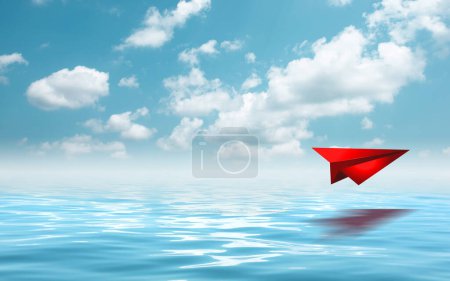 Photo for "Red paperplane in the beautiful seascape with cloud on a sunny day." - Royalty Free Image