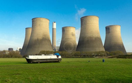 Photo for Boat and power station - Royalty Free Image