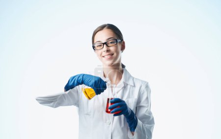 Photo for Woman doctor professional with vaccine flasks in hand analyzes - Royalty Free Image